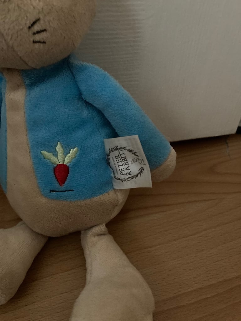 Selection of soft toys inc Peter rabbit bunny, giraffe, Winnie the Pooh and animal stacking ring