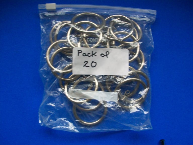 Twenty used silver Metal Curtain Rings. With hanging hooks. For curtains Poles.