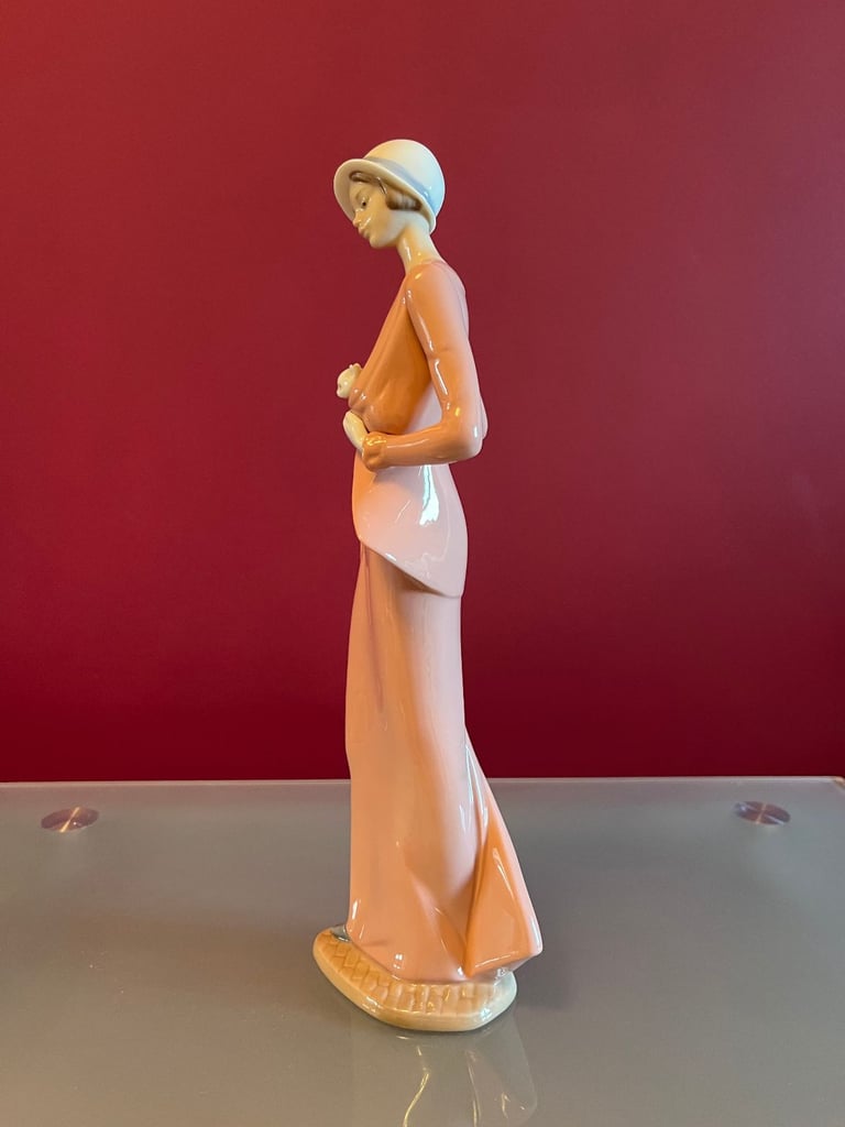 NAO Figurine - Woman, in 1920s outfit, carrying a cat & umbrella