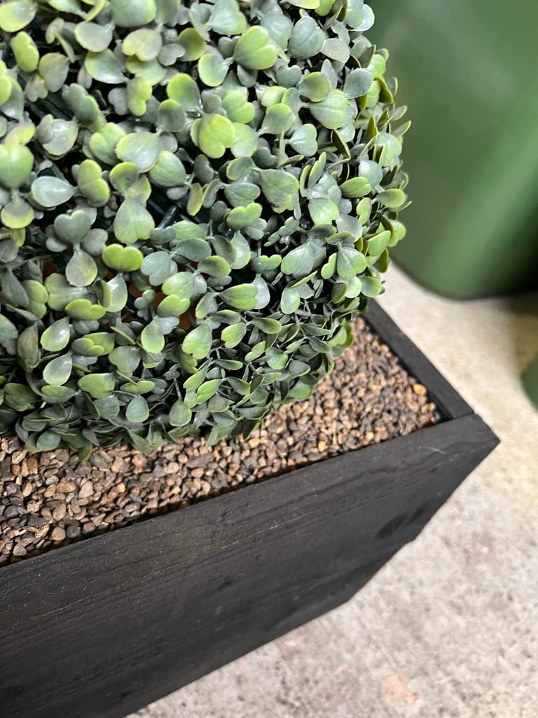Fake plant in planter 