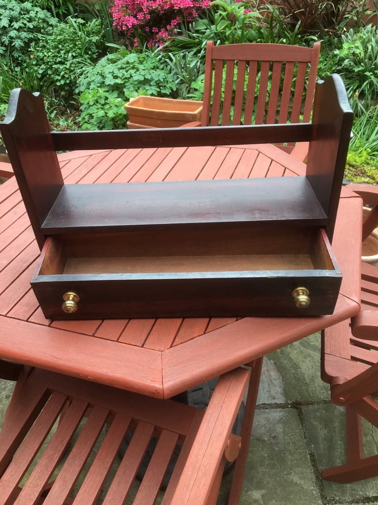 image for A wooden desk top book rack with drawer.