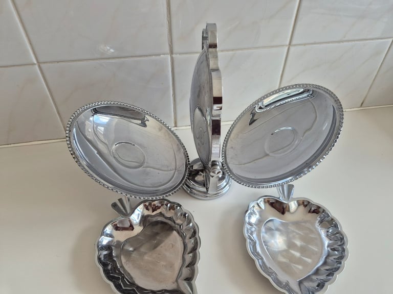 Folding Cake stand, chrome/tin. with 2 leaf shaped serving dishes. £10.00. lincoln