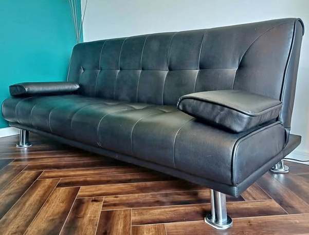 Leather sofa bed like new (can deliver)