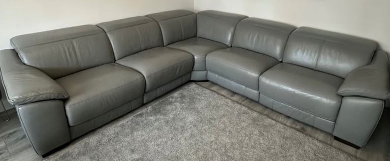 DFS Grey leather corner sofa with 2 x electric recliners. Like New! 