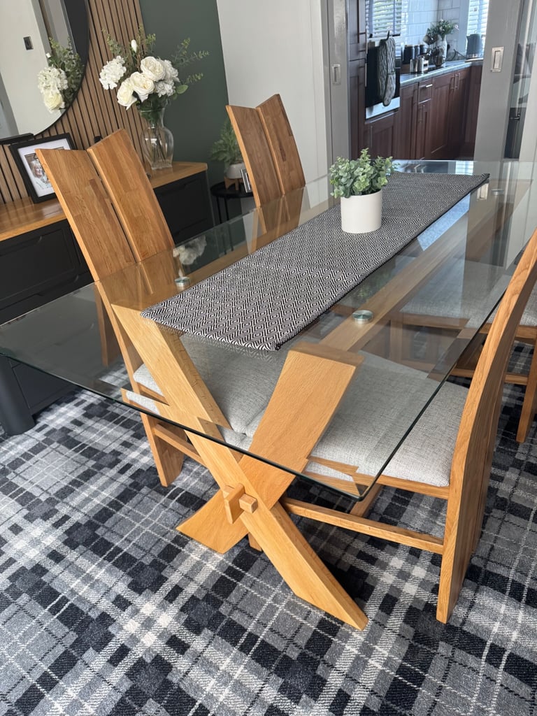 Glass dining table and four chairs