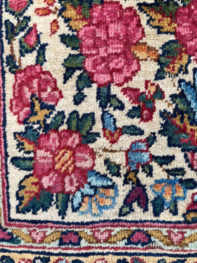 A pair of Antique Kirman mats 