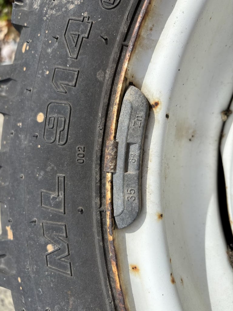 Land Rover tyre and wheel - ML 914  6.00 – 16 M+S