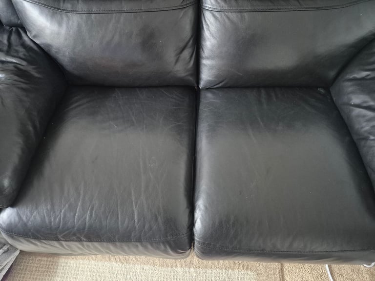 Two seater leather reclining sofa
