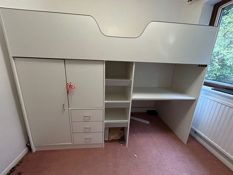 Cabin bed with built-in wardrobe and workstation. 