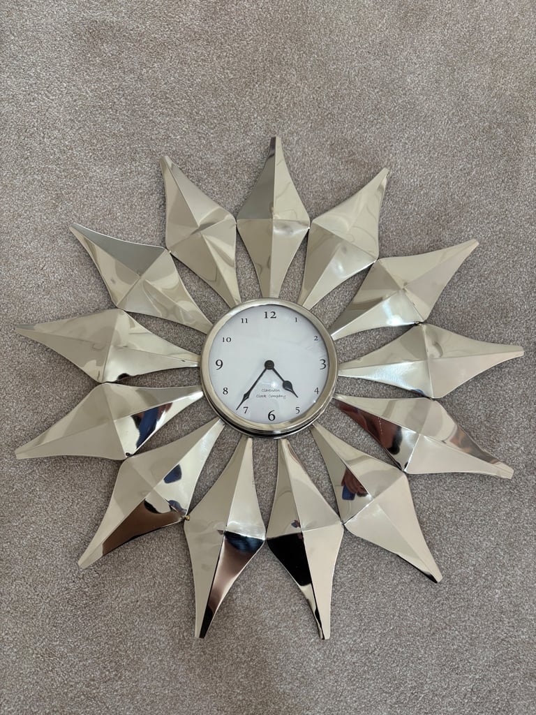 image for Sun Star Wall Clock Silver White Mirror Effect TK Maxx Homesense