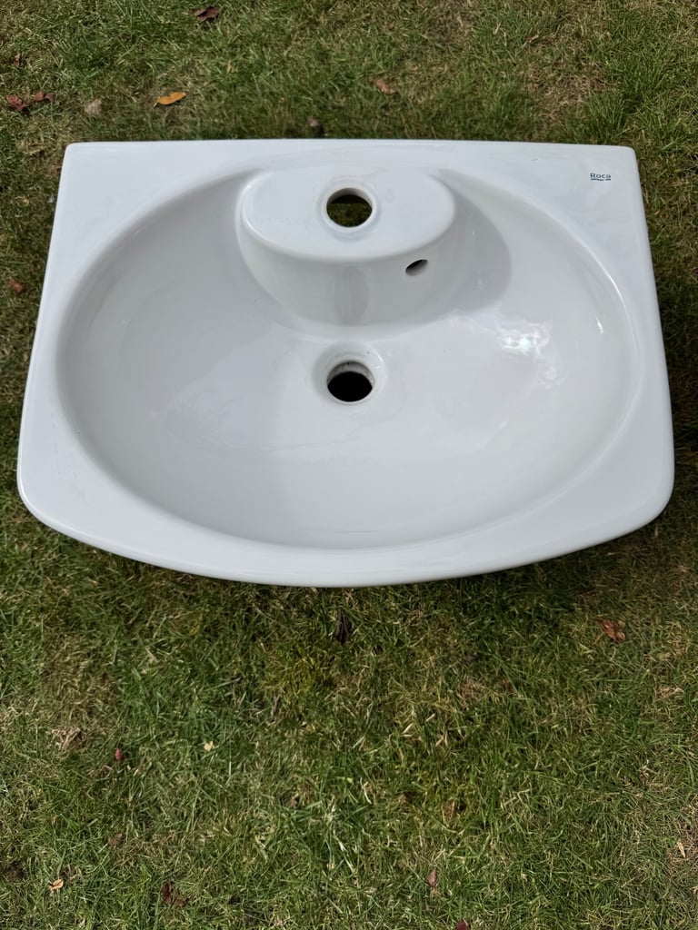 Roca brand white ceramic wall hanging cloakroom sink.  