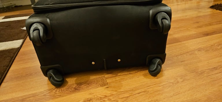 Trip LARGE Suitcase with extra small bag.