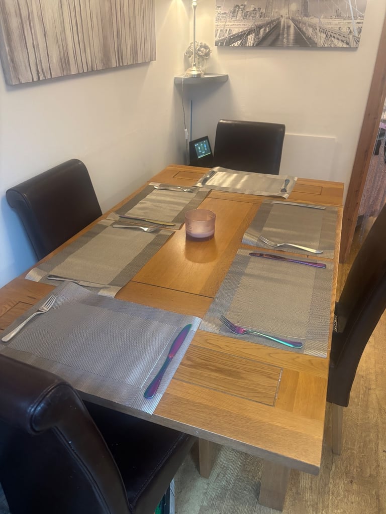 Solid oak extending dining table with chairs and matching mirror