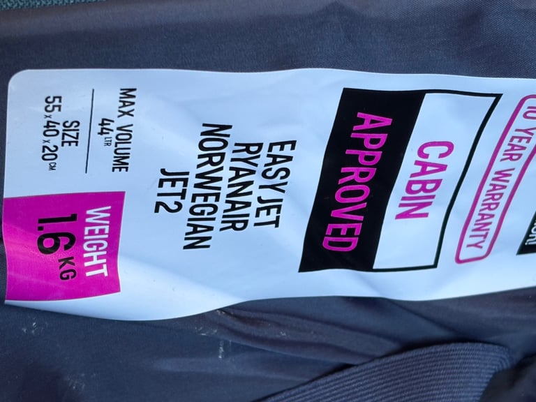 Small suitcase with wheels and extending handle