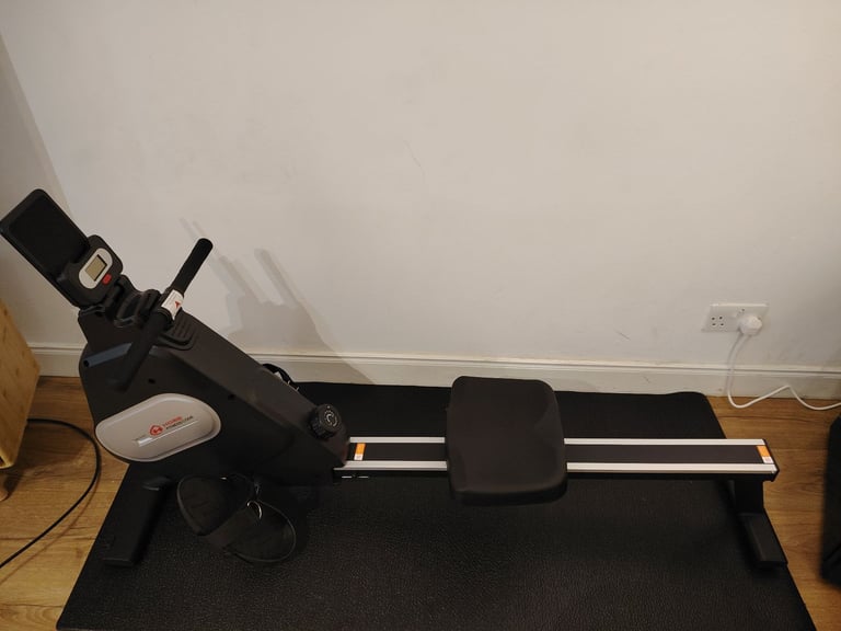 Nearly new rowing machine with mat