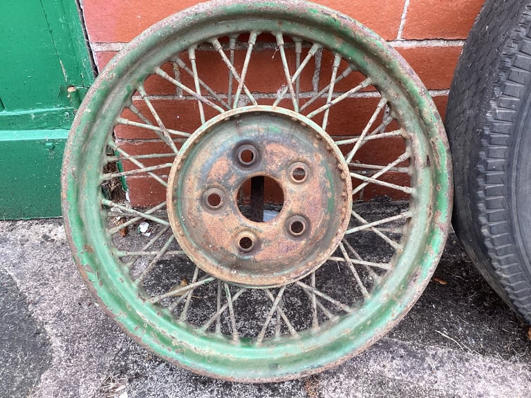 Two Spoked wheels for a vintage car