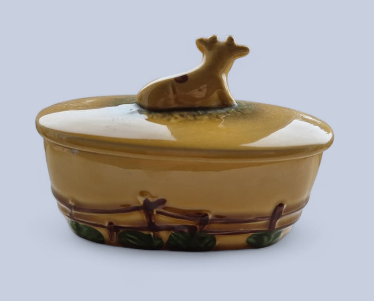 Collector's Guernsey cow butter dish, has 2 small chip round rim not visible when lid is on. 
