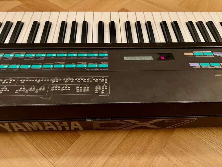 Yamaha DX7 Synthesizer Mk1 with original stand, soft case and manual.