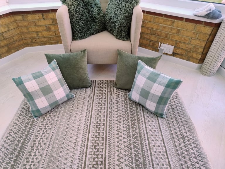 Dunelm rug plus 6 cushions in green colour.