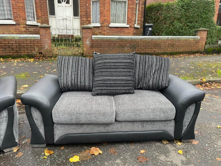 3 and 2 seater sofa in a black land grey fabric and leather couple of wee marks only £245