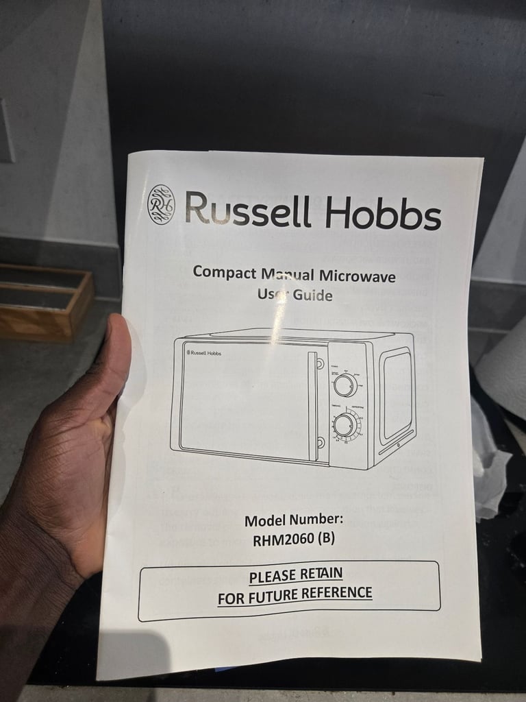 Brand new russell hobbs (rhm2060b) microwave with a small dent on the side (working perfectly)