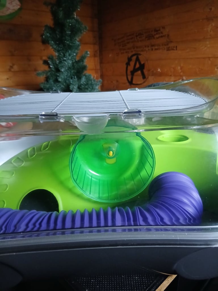 Hamster cage with wheel and tube