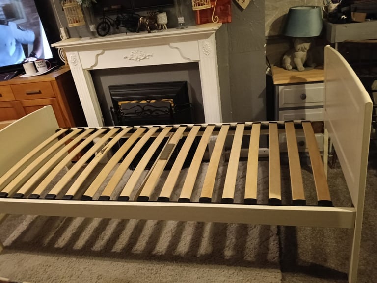 White wooden single bed and mattress 