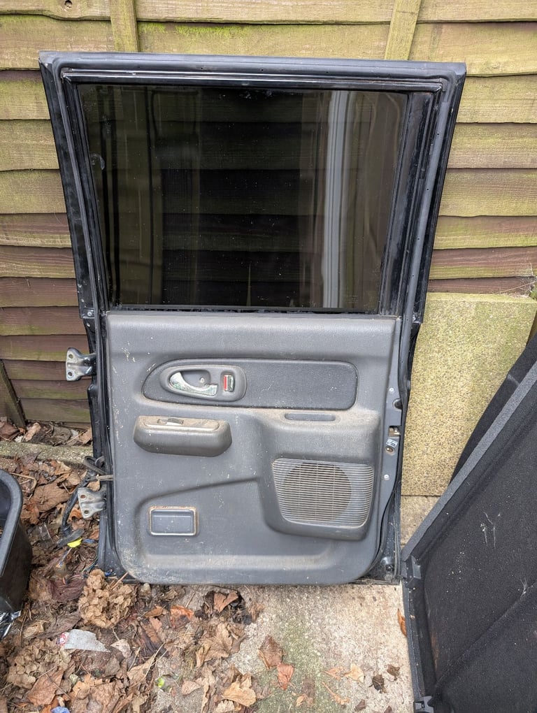 Mitsubishi L200 K74 06 black drivers side back door 