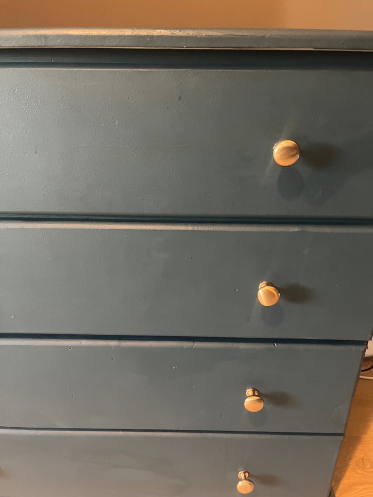 Wardrobe and drawers set navy blue , chunky wood gold knobs . 