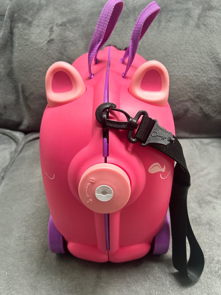 Pink ride on suit case never used 