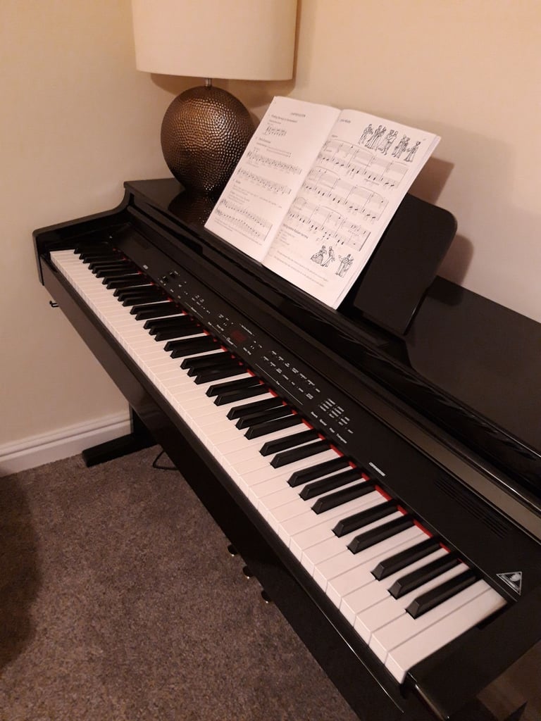 Piano Concert Electric with high glossy black lacquer finish. 