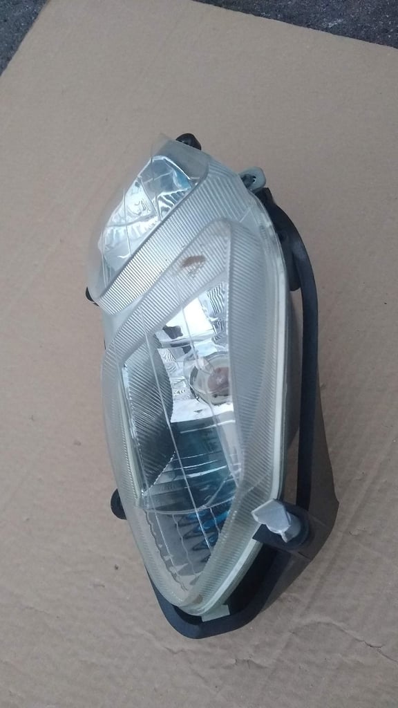 PGO T-Rex moped scooter headlight, new condition.
