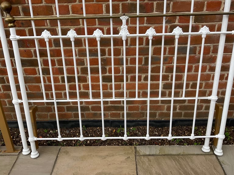 White wrought iron bedstead