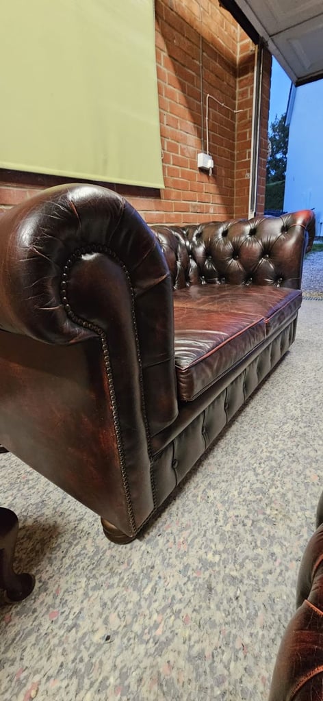 Beautiful vintage 2 seater chesterfield sofa with matching footstool.