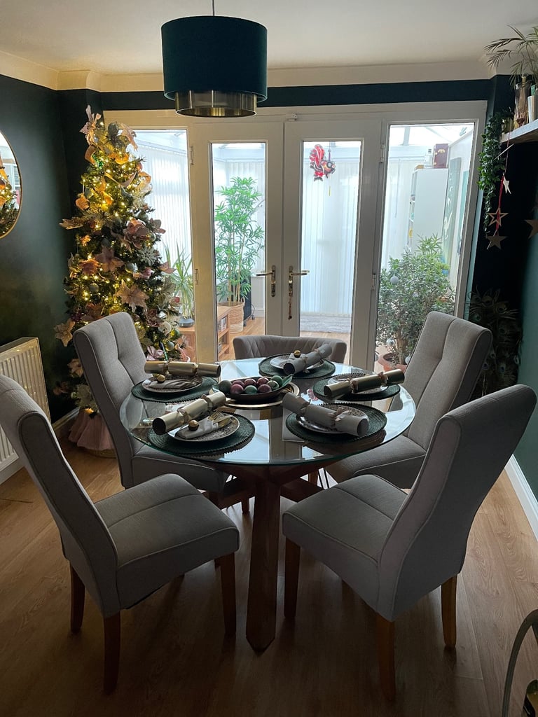 Oak and glass dining table and four chairs