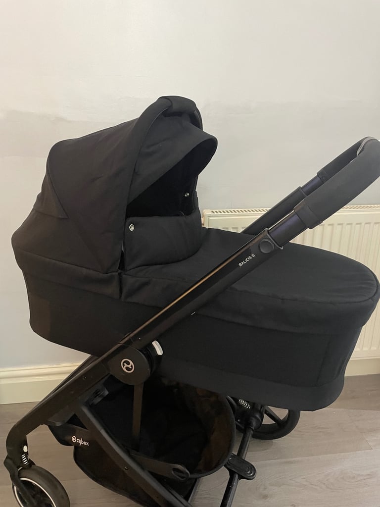 image for Cybex black pram & pushchair 