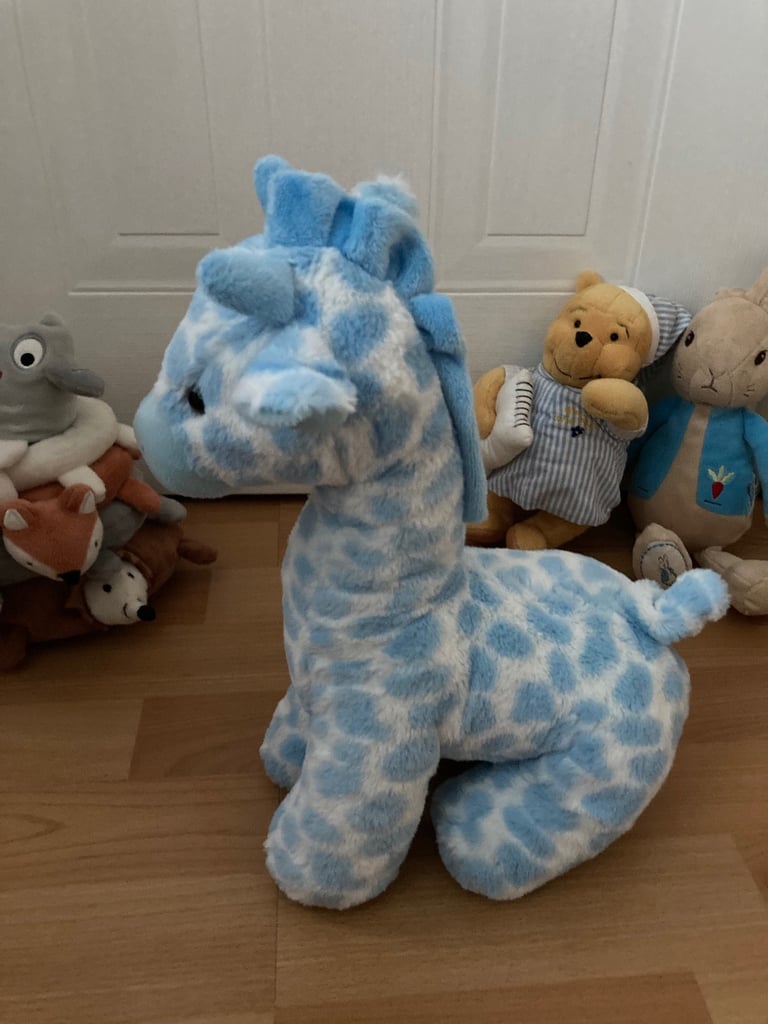 Selection of soft toys inc Peter rabbit bunny, giraffe, Winnie the Pooh and animal stacking ring