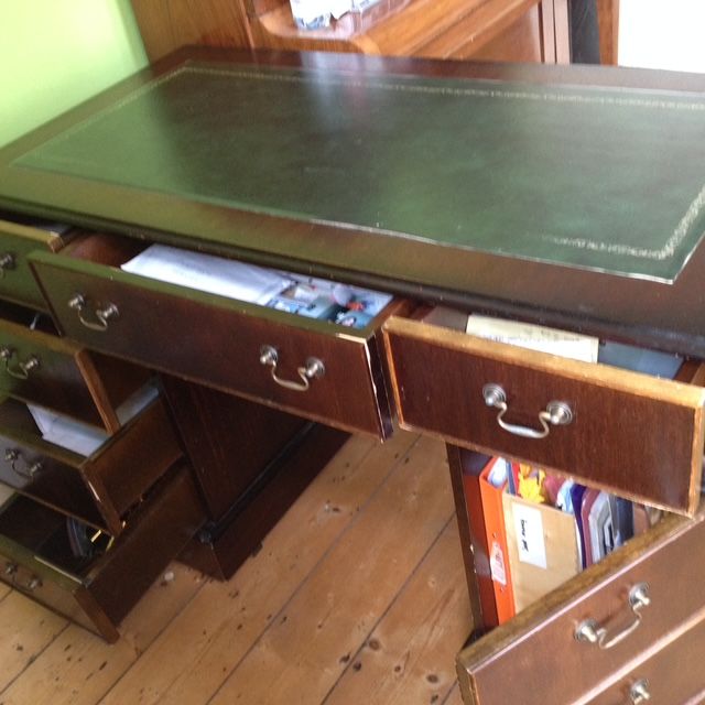Lovely fake antique writing desk. Nice soft top. 