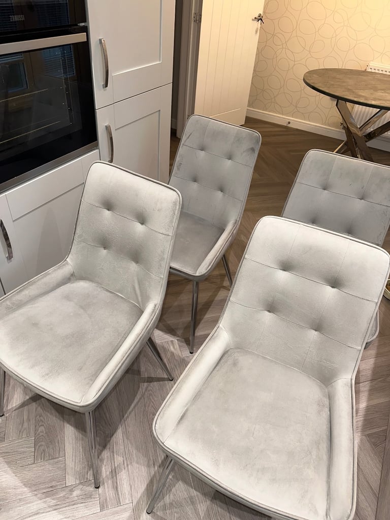 Grey marble effect glass top dining table with chrome legs and 4 grey suede dining chairs 