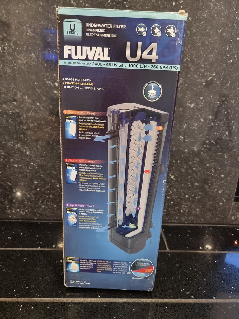 Fluval U4 underwater filter, thermometer and faux stone decoration