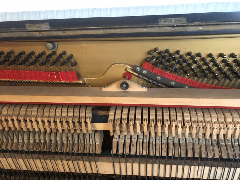 Upright Piano by Stanley Brinsmead London, 7 Octaves, 88 keys, dark wood.  Good condition.