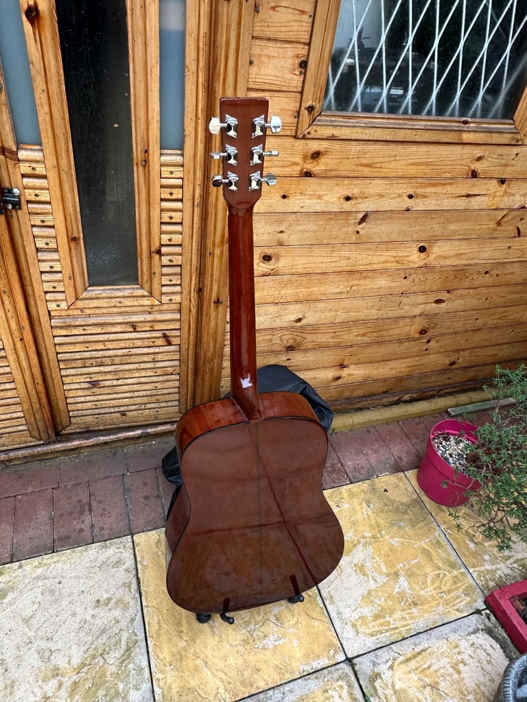 Full encore guitar with shoulder strap and case 
