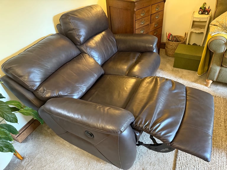 Leather two seater reclining sofa