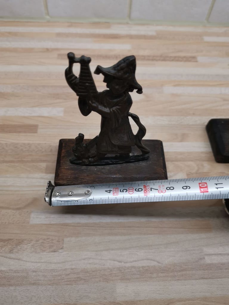 Two mounted bronze 19th Century musician ornaments with a metal plaque