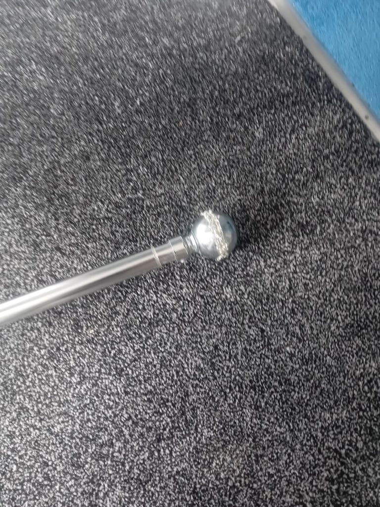 Silver extendable curtain pole
