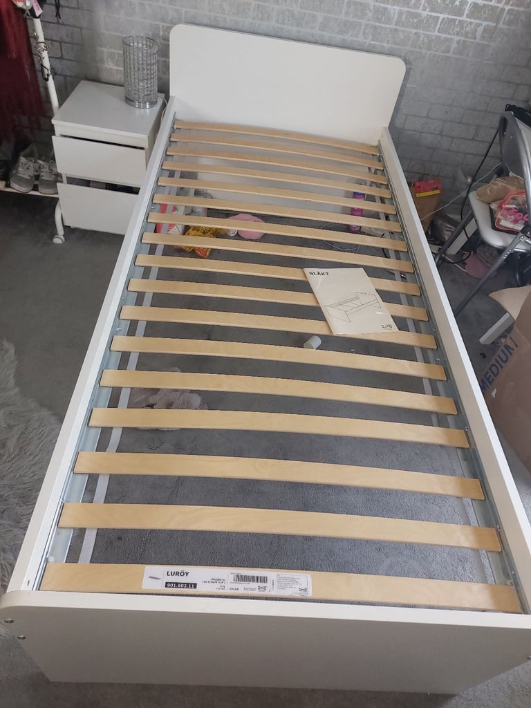 Single bed in white colour with bedside 