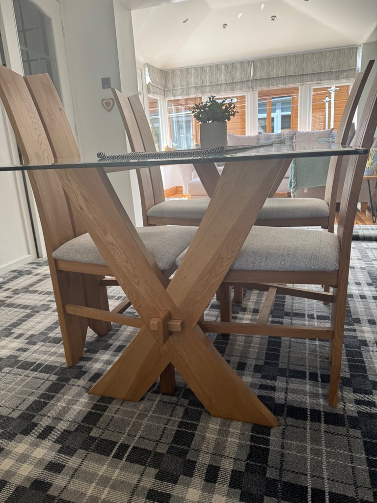 Glass dining table and four chairs