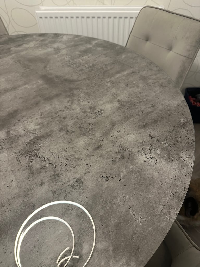 Grey marble effect glass top dining table with chrome legs and 4 grey suede dining chairs 