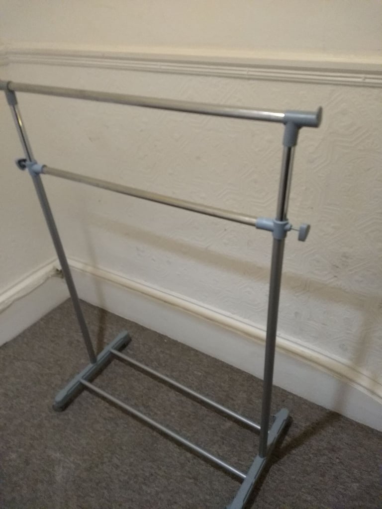 Clothes hanging dual rail. Adjustable height. shoe rack. On wheels.