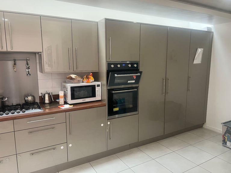 Home Renovation Deal Kitchen Drawers. Bi-folding door and a window  